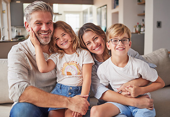 Image showing Happy, smile and portrait of a family relax in the living room bonding on the sofa together. Happiness, care and parents sitting and holding their children with love on a lounge couch at home