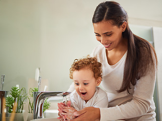 Image showing Mother, boy and washing hands help in water as fun covid bacteria cleaning and morning house hygiene wellness. Mom, woman or parent and child by bathroom sink in Italy home safety healthcare skincare