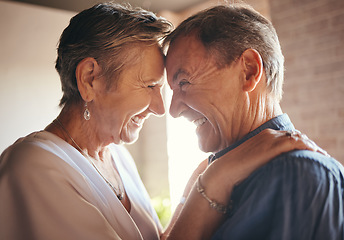 Image showing Love, happy and laugh elderly couple hug and bond in their home together, cheerful and sharing a funny joke. Humour, care and affection by senior man and woman enjoying retirement and playful fun