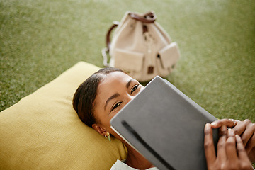 Image showing Shy student, notebook and hiding face in study, learning and education break on turf grass in school, college or Brazilian university campus. Girl, relax or fun woman with library or classroom books