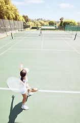 Image showing Women, tennis and athlete with racket equipment or gear play a match at outdoor sport activity on a court. Fitness, exercise and workout in training, game or match during a competitive sport