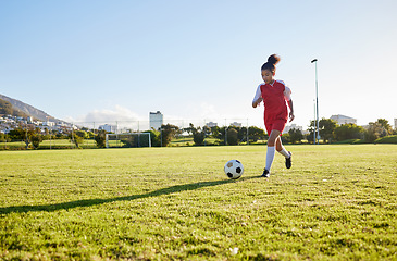 Image showing Girl running on grass field, soccer fitness to kick football and young kid training energy in Brazil. Strong healthy child, future athlete exercise for goal and play outdoor sports game happiness