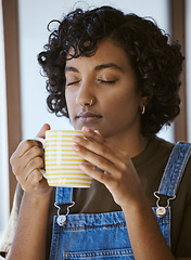 Image showing Woman from India with coffee in the morning in her home, drinking and happy. Young girl having a warm drink, breakfast tea and enjoying aroma from coffee cup. Relax, calm and peace before work