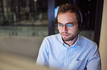 Image showing Man, work and crm with reflection on glasses in office for telemarketing with computer at business. Businessman, working and customer service at company, workplace or call center in overtime in night