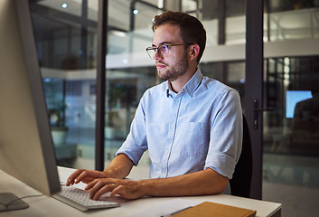 Image showing Night worker, businessman and computer planning, working and typing online project proposal, email or trading report. Focus young employee, desktop website and strategy ideas in dark marketing agency