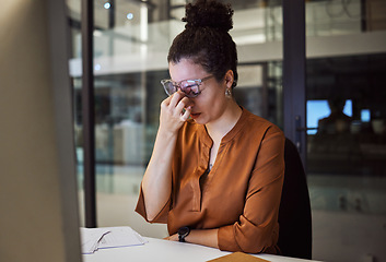 Image showing Stress, burnout and woman with a headache tired from working overtime at her office desk due to paperwork deadlines. fatigue, mental health and overwhelmed administrator frustrated with a migraine