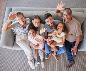 Image showing Hands, wave and big family top view on sofa or couch in living room home. Portrait of caring mom, dad and girls with grandparents together in house lounge spending time together, bonding and love.