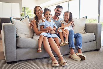 Image showing Parents, kids and happy family home portrait on living room sofa, couch and lounge to relax, quality time and fun together in Spain. Smile mom, dad and young girl children with love, support and care