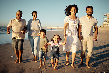 Image showing Portrait of happy family with little kids walking together on beach during sunset. Adorable little children bonding with mother, father, grandmother and grandfather outdoor on summer vacation