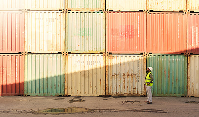 Image showing Logistics container, delivery and black man doing inspection of cargo at an outdoor distribution warehouse. African port manager planning shipping of stock while working in the supply chain industry