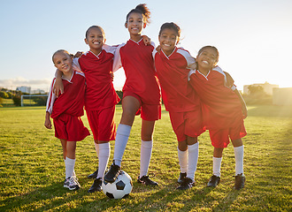 Image showing Soccer, team sports and portrait of children training for football game on a grass field together. Happy, smile and young group of girl athletes in partnership and teamwork for sport match at school