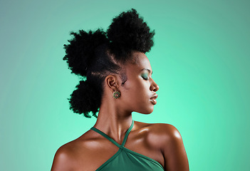 Image showing Black woman, green makeup and face on skin for beauty, fashion and cosmetics against backdrop. Model, girl and hair, show afro, eyeshadow and lips in portrait with studio background in New Orleans