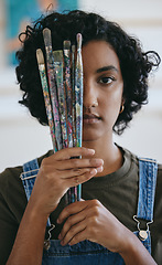 Image showing Creative, woman with paint brushes in hand and art student from India holding brush over eye. Creativity, idea and painting, portrait of Indian girl artist with painter tools in hand in school studio