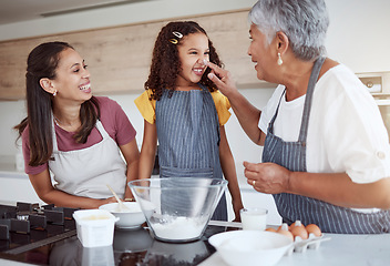 Image showing Family baking, flour fun and grandmother teaching children to bake cake in the kitchen of their home. Happy girl, mom and senior person cooking together, learning about food and being playful