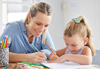 Image showing A happy mother, girl child drawing on paper and coloring together with pencils for preschool homework. Children in kindergarten, having fun being creative and learning creativity art skills from home