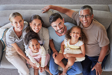 Image showing Smile, happy big family on sofa and top view of generations, grandparents and parents together in living room. Diversity portrait, love and couple, girl kids and grandpa and grandma relax at home.