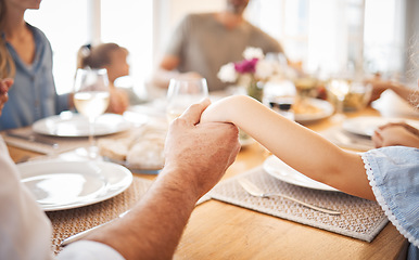 Image showing Family, holding hands and thanksgiving lunch prayer in house, home and restaurant with men, women and children. Zoom, worship praying community with kids, parents or seniors for festive food at table