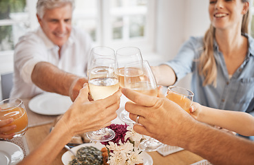 Image showing Wine, toast and happy family celebration at a table, bonding and sharing a meal in their family home together. Love, relax and cheerful group toasting with drinks, enjoying quality time at gathering