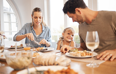 Image showing Dining table, family and child bonding with dad while enjoying food together in Canada home. Cute, happy and adorable daughter with smile looking at her father with love and appreciation.