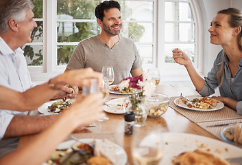 Image showing Family, bonding or thanksgiving food on table in house, home or restaurant in party, event or lunch. Happy smile or relax men, woman or senior for festive celebration or nutrition health meal reunion