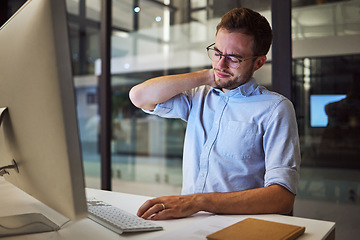 Image showing Burnout, neck pain and tired with an exhausted businessman working on a computer in his office late at night. Stress, headache and problem with a male employee at work on a project deadline