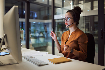 Image showing Call center, customer support and insurance agent consulting at night in a office at a contact help desk. Sales, telemarketing and employee working hard in helping, talking and listening via headset