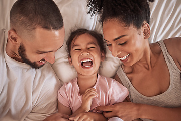 Image showing Children, family and bedroom with a girl, mother and father laughing, joking or tickling in bed from above. Kids, happy and love with a woman, man and daughter having fun together in their home