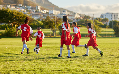 Image showing Girl, soccer and fitness team in field sports playing fun game together in training for competition outdoors. Group of female football players in teamwork sport match for health and exercise outside