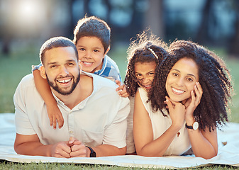 Image showing Family, children and smile on grass for portrait on blanket to relax show love, care and happiness. Black mom, dad and kids on picnic in park, garden or backyard smile together in sunshine in Toronto