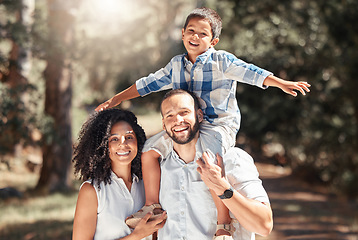 Image showing Happy, smile and portrait of a family in forest together having fun in nature while on holiday. Happiness, love and caring parents from puerto rico with their child in woods while on summer vacation.