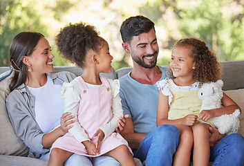 Image showing Happy family, parents and girl children on sofa bonding, love affection and care together at family home. Mom, father and young kids relax, smile and happiness sitting on lounge enjoy quality time