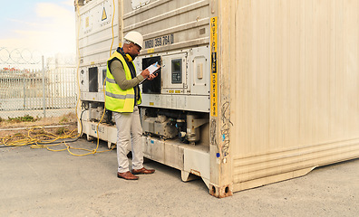 Image showing Mechanic, black man and refrigerator checklist for container cargo maintenance at shipping yard. Professional stock distribution worker busy with technical notes for freight storage plant crate.