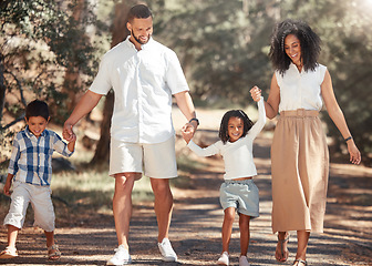 Image showing Family, love and kids walking with parents in park, happy and relax in nature together. Freedom, active and peaceful cardio with excited children enjoy freedom with mother and father, playful fun