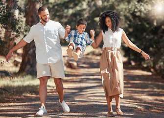 Image showing Smile, nature and happy family in a park walking and having fun as a young child plays with mother and father in USA. Love, happiness and parents enjoy quality time and bonding with kid in summer