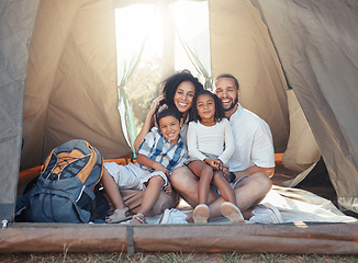 Image showing Happy black family, smile and camping in tent for fun, adventure and bonding together in nature. Portrait of African mother, father and children relax on holiday camp for summer vacation and outdoors