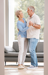 Image showing Senior couple dance together for retirement, real estate or marriage celebration with happiness in new house. Elderly pension people dancing to music with love, care and wellness in living room