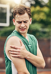Image showing Muscle injury, basketball or sport pain and man with emergency arm accident during game on an outdoor court. Professional athlete with medical problem during training and exercise for sport match