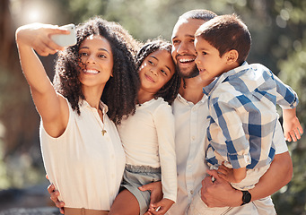 Image showing Family selfie with smartphone in a park or nature for outdoor summer wellness, hiking and happy holiday memory on mobile digital gallery. Mother portrait photo of children and father with lens flare