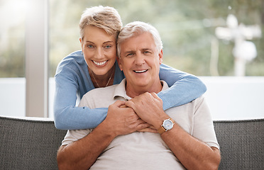 Image showing Happy senior couple in living room portrait with love, care and support hug in home living room. Dallas elderly or pension people relax on sofa together and happiness with life wellness or retirement