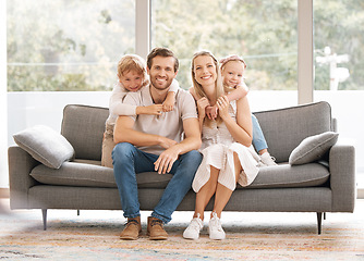 Image showing Happy, family smile and relax on living room sofa for holiday break together at home. Portrait of white couple and kids relaxing, smiling and enjoying time in happiness sitting on couch in the lounge