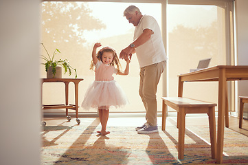 Image showing Family, young girl and grandfather dancing in living room together. Grandparent and grandchild in family home doing dance and having fun in the morning. Old man enjoying retirement with child at home