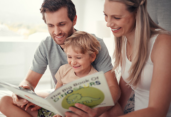 Image showing Parents, child and reading dinosaur books in family home for educational fun, learning and happy development in Australia. Mom, dad and kid playing, learning and laughing funny animal story together