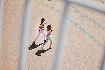 Image showing Fitness, exercise and young women running to train for an outdoor sports marathon together. Motivation, training and friends with a healthy, wellness and active lifestyle doing cardio workout outside