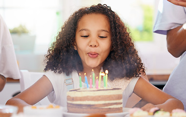 Image showing Birthday, kid and cake candles celebration of a girl from Atlanta at a party at home. Celebrate, happy and candle blowing of child with happiness, food and people at a kids event in a house