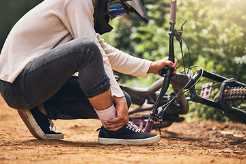 Image showing Sports bicycle and man with ankle injury on nature cycling trail in accident from bad decision. Cyclist athlete pain, inflammation and joint problem from dangerous wheel stunt movement.