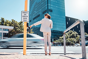 Image showing Woman, traffic light button and city road waiting to cross pedestrian to walk or commute to work office building. Female with covid mask at crosswalk by asphalt street while traveling in south africa