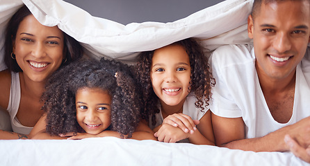 Image showing Portrait of happy black family bonding on a bed, relax and smile in a bedroom together. Love, blanket and happiness parents enjoying free time with their children, being playful and love in morning