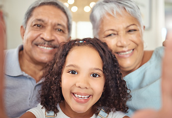 Image showing Happy grandparents, girl child taking a selfie with senior couple and visit them in retirement. Kid loves hnaging out with elders, sharing online with social media and enjoy time together as a family