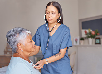 Image showing Elderly patient, nursing and nurse with a stethoscope listening to heartbeat during a health consultation. Healthcare professional, senior woman and medical checkup in her room at the retirement home