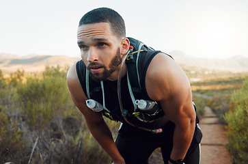 Image showing Sweating, breathing and tired fitness man running outdoors with fatigue, body challenge and struggle for exercise. Male runner athlete, mental break and nature trail rest to breathe in mindset focus